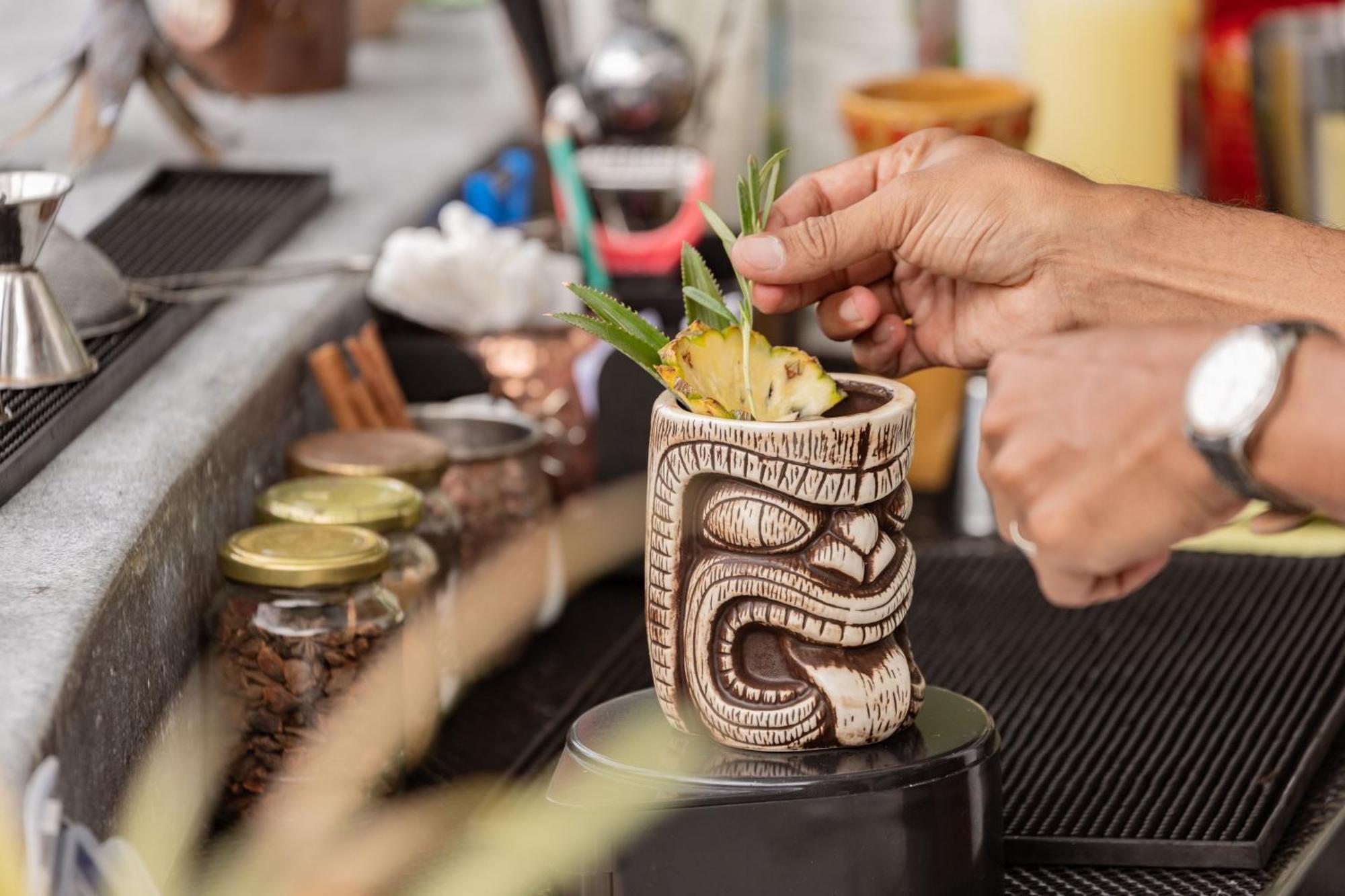 Skyview Resort Phuket Patong Beach Luaran gambar A tiki drink being garnished
